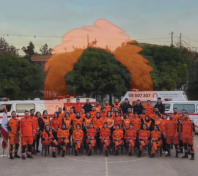 Aareen's Ambulance and Emergency team poses in front of the ambulances.